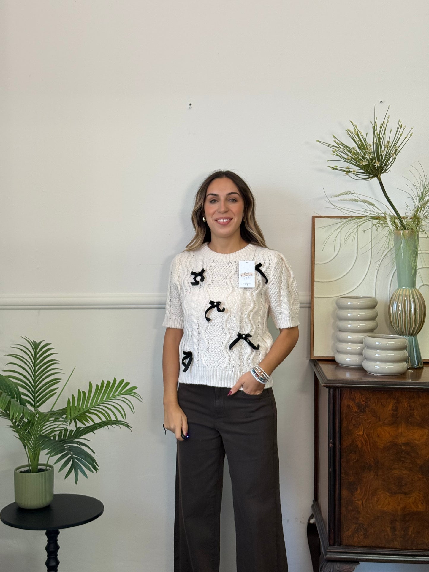 Maglione con perle e fiocchetti