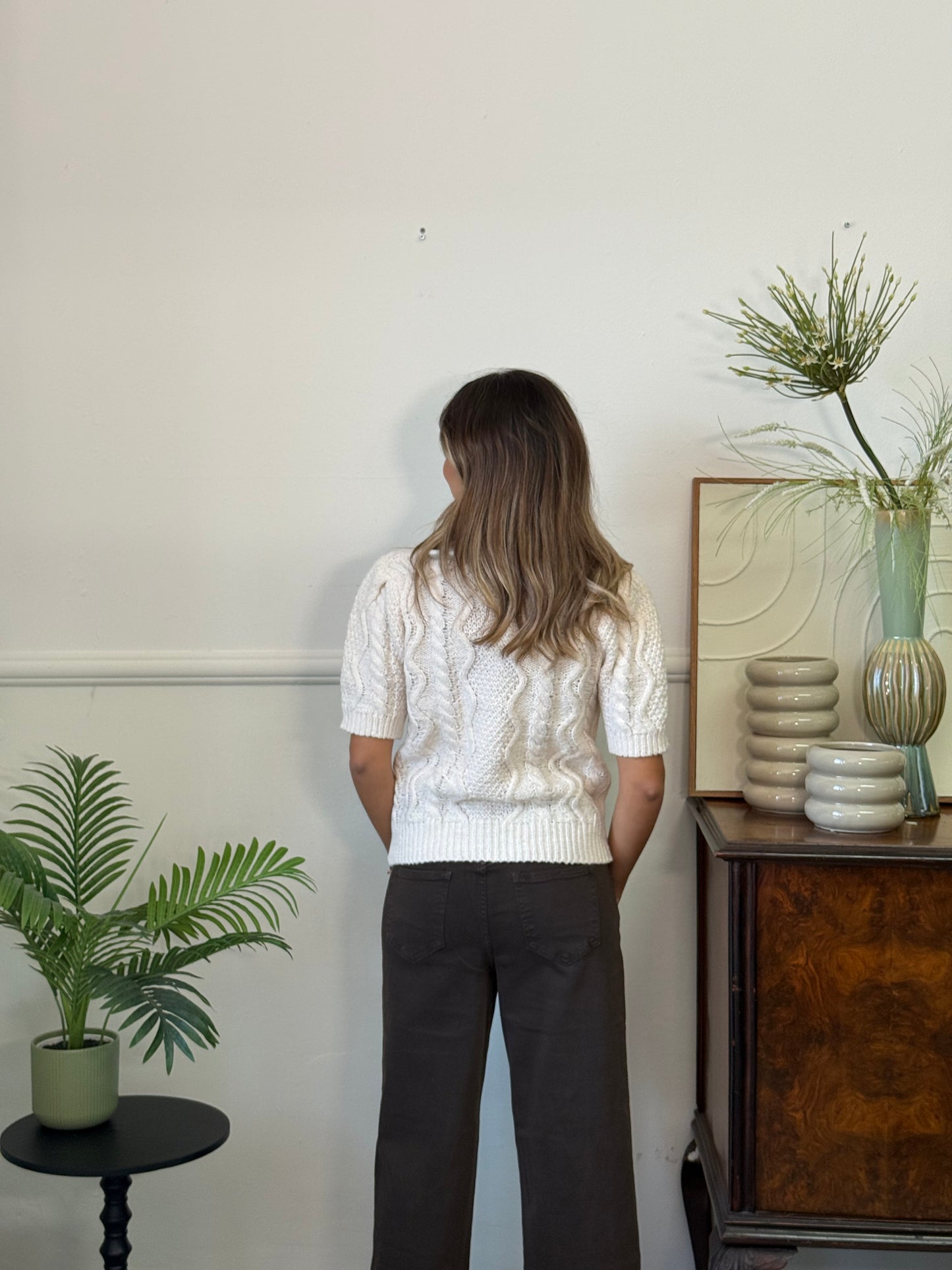 Maglione con perle e fiocchetti