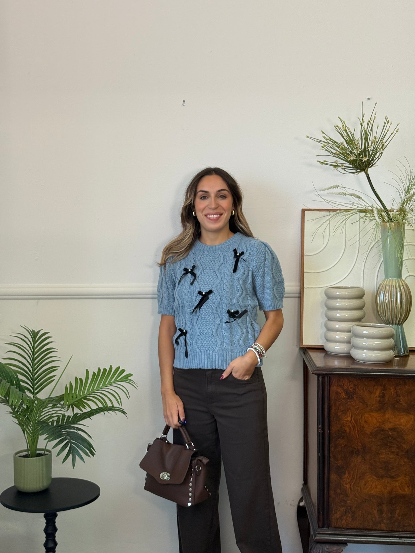 Maglione con perle e fiocchetti